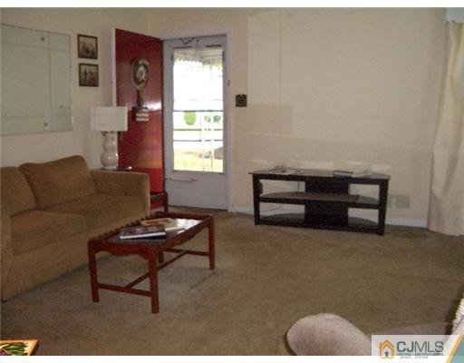 2 Colfax Road Edison, NJ 08817 - Photo 3 of 25 a living room with furniture and a window