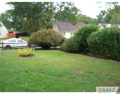 2 Colfax Road Edison, NJ 08817 - Photo 24 of 25 a view of a house with a yard porch and sitting area
