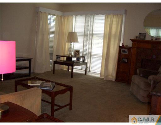 2 Colfax Road Edison, NJ 08817 - Photo 4 of 25 a living room with furniture and a flat screen tv