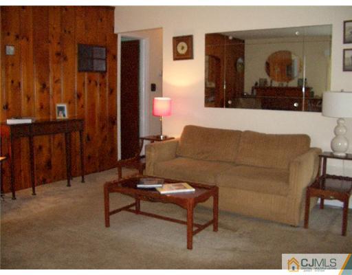 2 Colfax Road Edison, NJ 08817 - Photo 6 of 25 a living room with furniture and a mirror