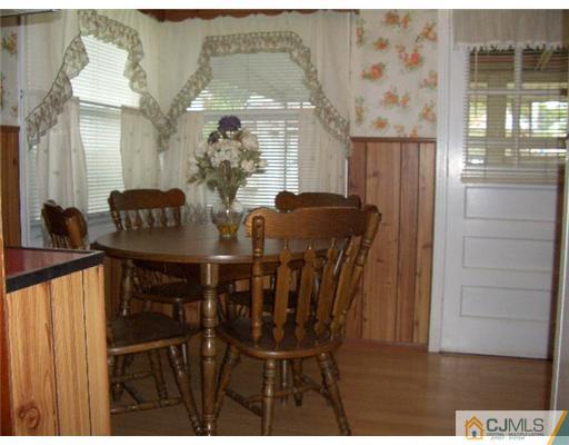 2 Colfax Road Edison, NJ 08817 - Photo 7 of 25 a view of a dining room with furniture and chandelier