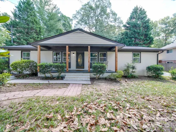 front view of a house with a yard