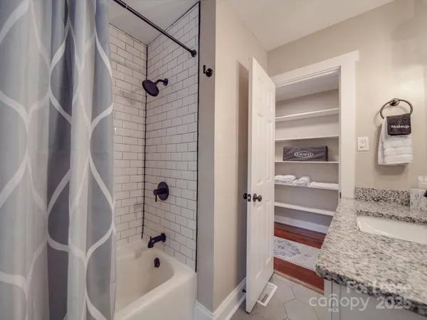 a bathroom with a tub and a shower