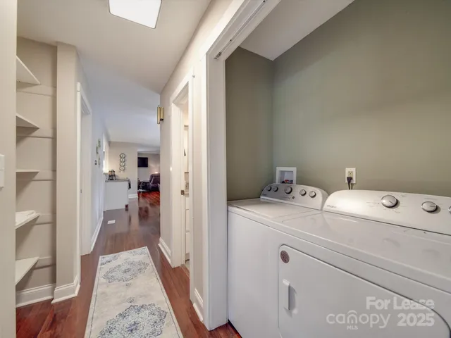 a view of a hallway and a livingroom with a furniture