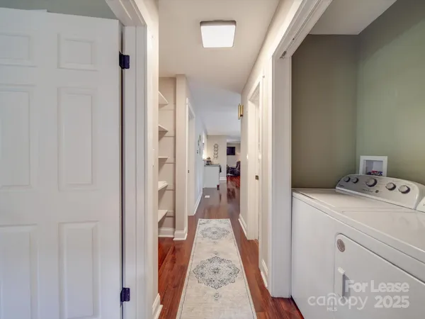 a view of a lake with houses in back