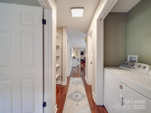 a view of a lake with houses in back