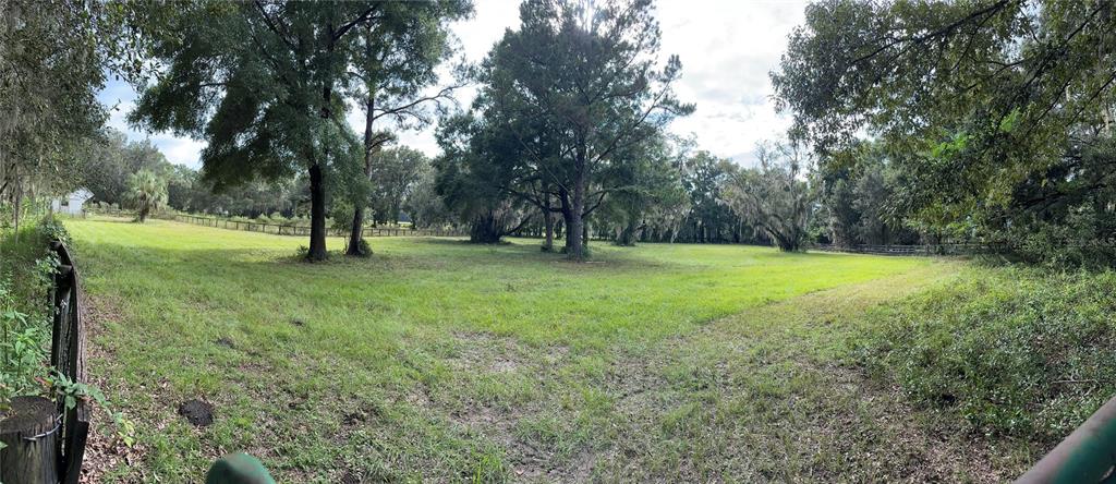 17067 Northwest Gainesville Road Reddick, FL 32686 - Photo 20 of 25 a view of an outdoor space with a lake view