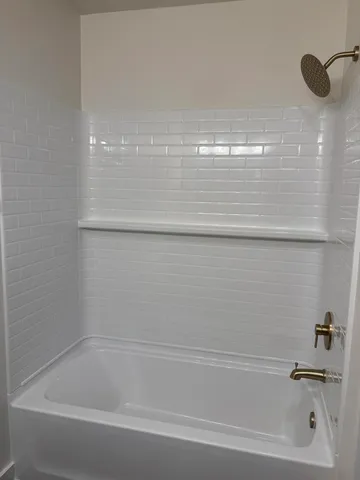 a close view of a bathtub in a bathroom