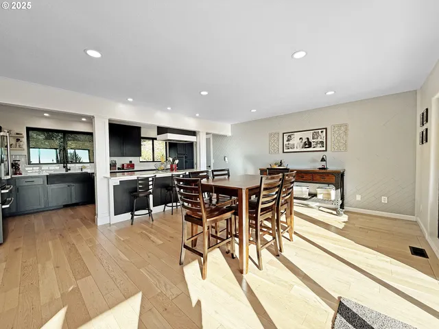 a kitchen with lots of counter top space and stainless steel appliances