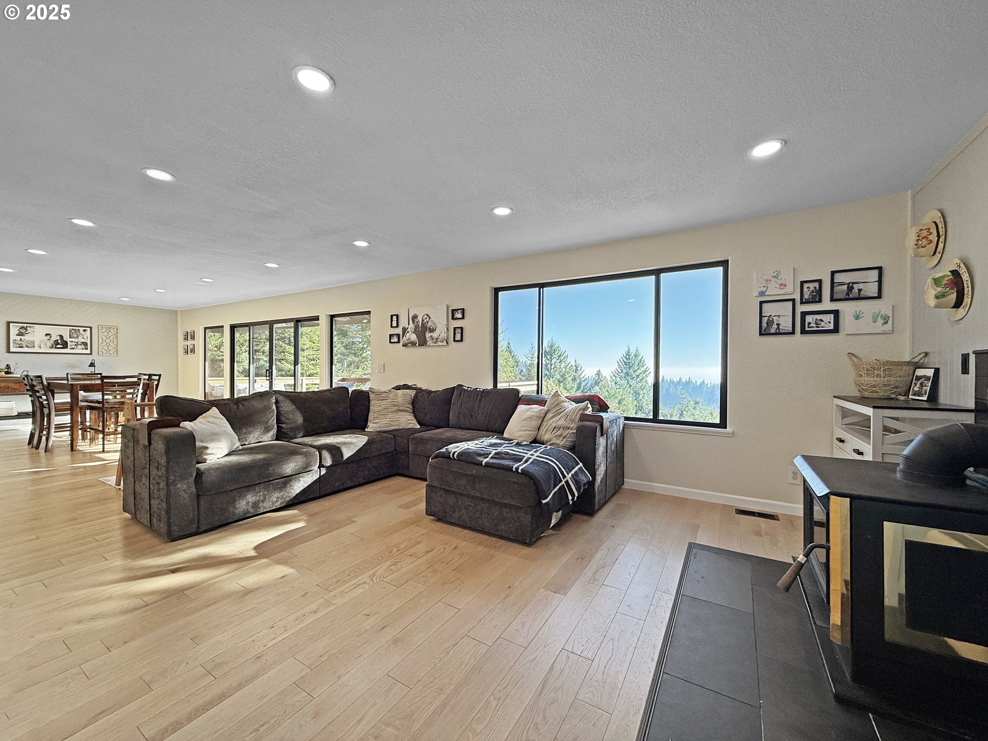18950 Timeus Ranch Road Brookings, OR 97415 - Photo 15 of 47 a living room with furniture and a wooden floor