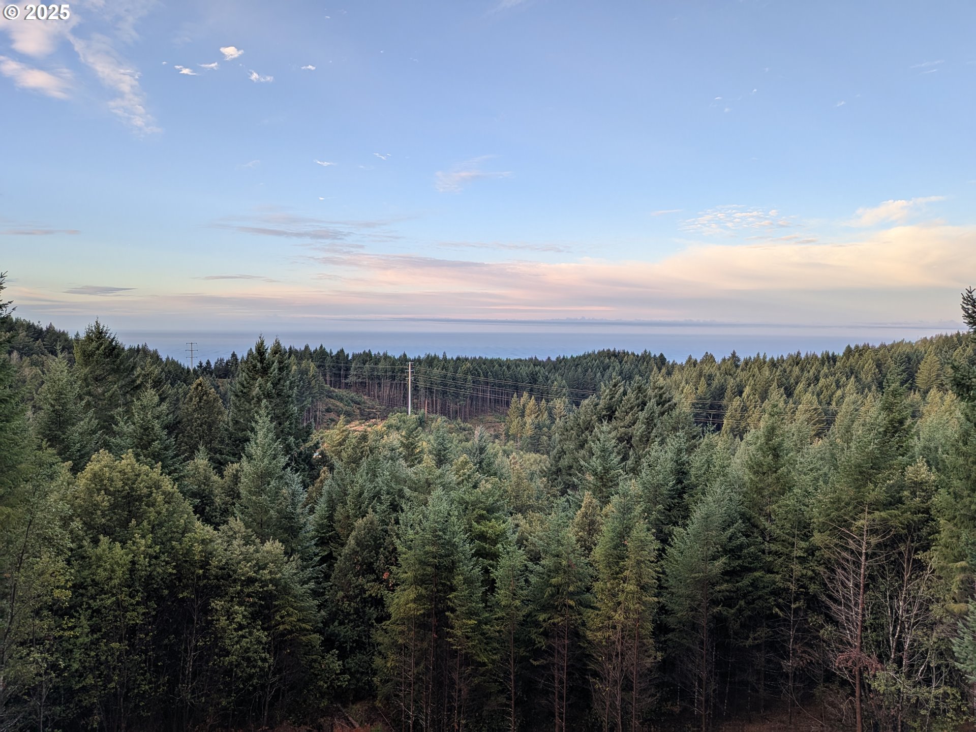 18950 Timeus Ranch Road Brookings, OR 97415 - Photo 2 of 47 a view of a city with sunset