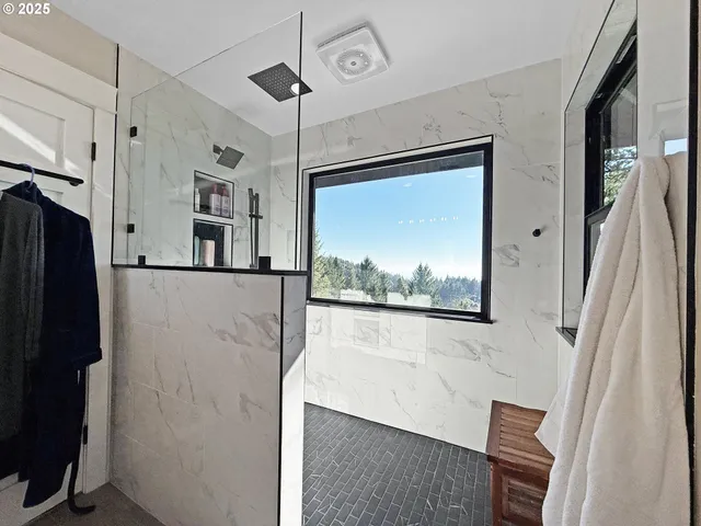 a view of a hallway with paintings on the wall