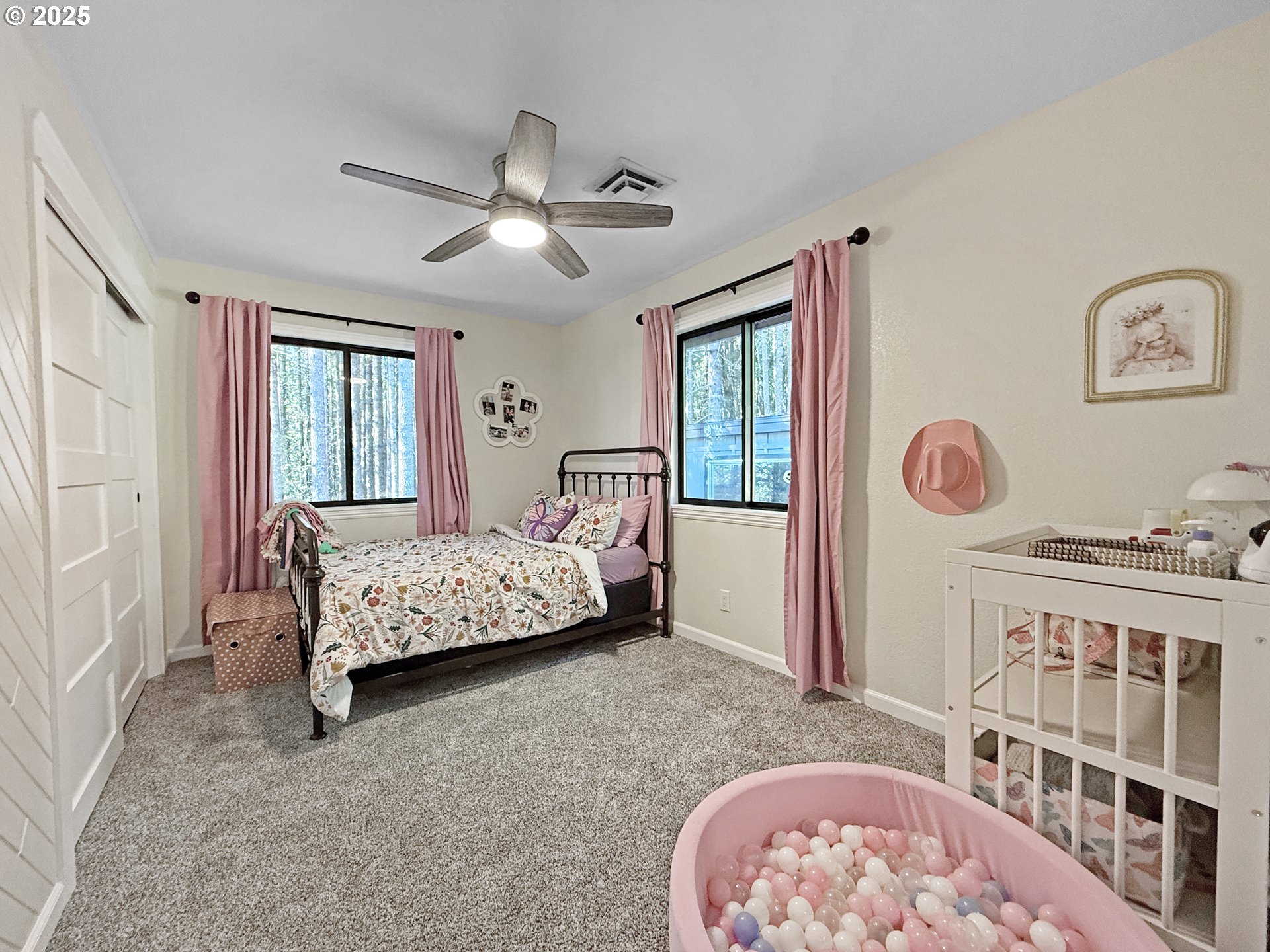 18950 Timeus Ranch Road Brookings, OR 97415 - Photo 24 of 47 a bedroom with a bed and a window