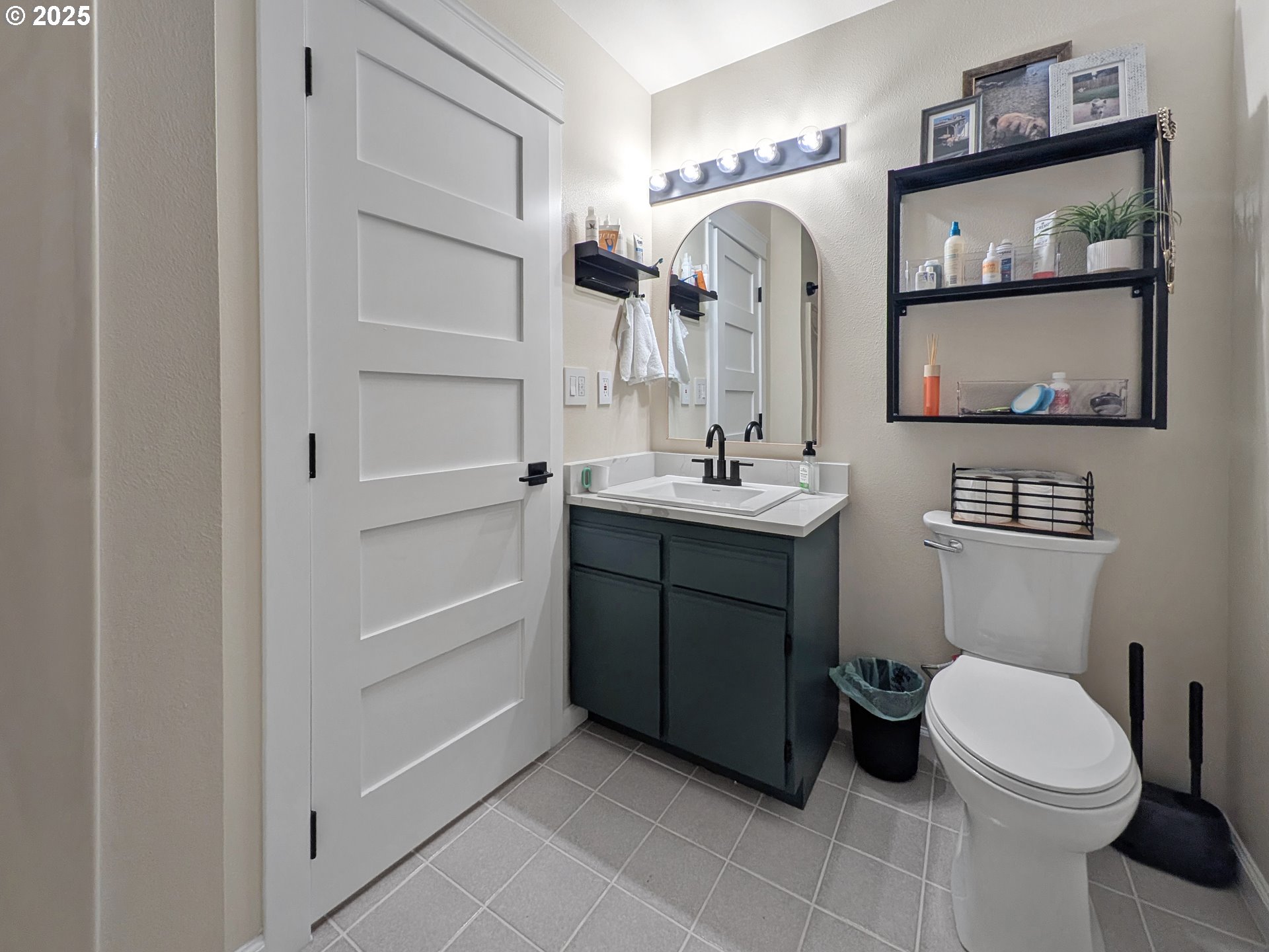18950 Timeus Ranch Road Brookings, OR 97415 - Photo 27 of 47 a bathroom with a sink a toilet and mirror