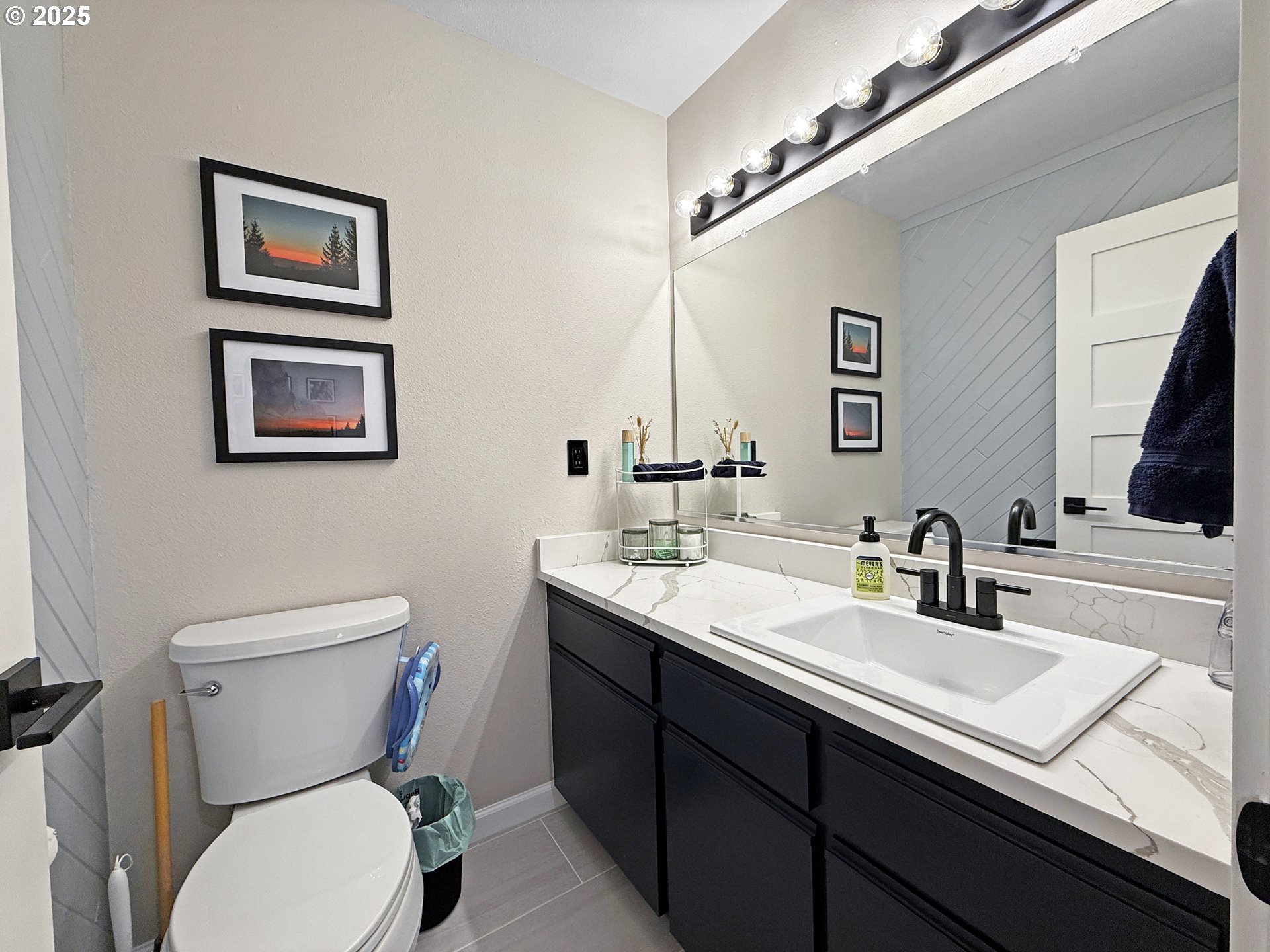 18950 Timeus Ranch Road Brookings, OR 97415 - Photo 33 of 47 a bathroom with a toilet a sink and mirror