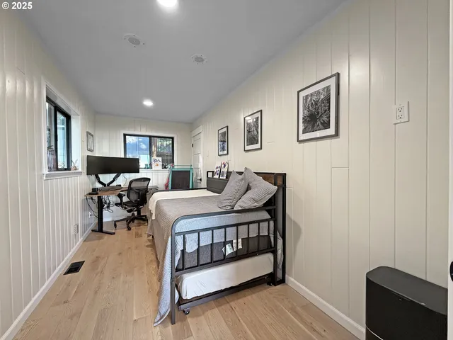 a bedroom with furniture and a window