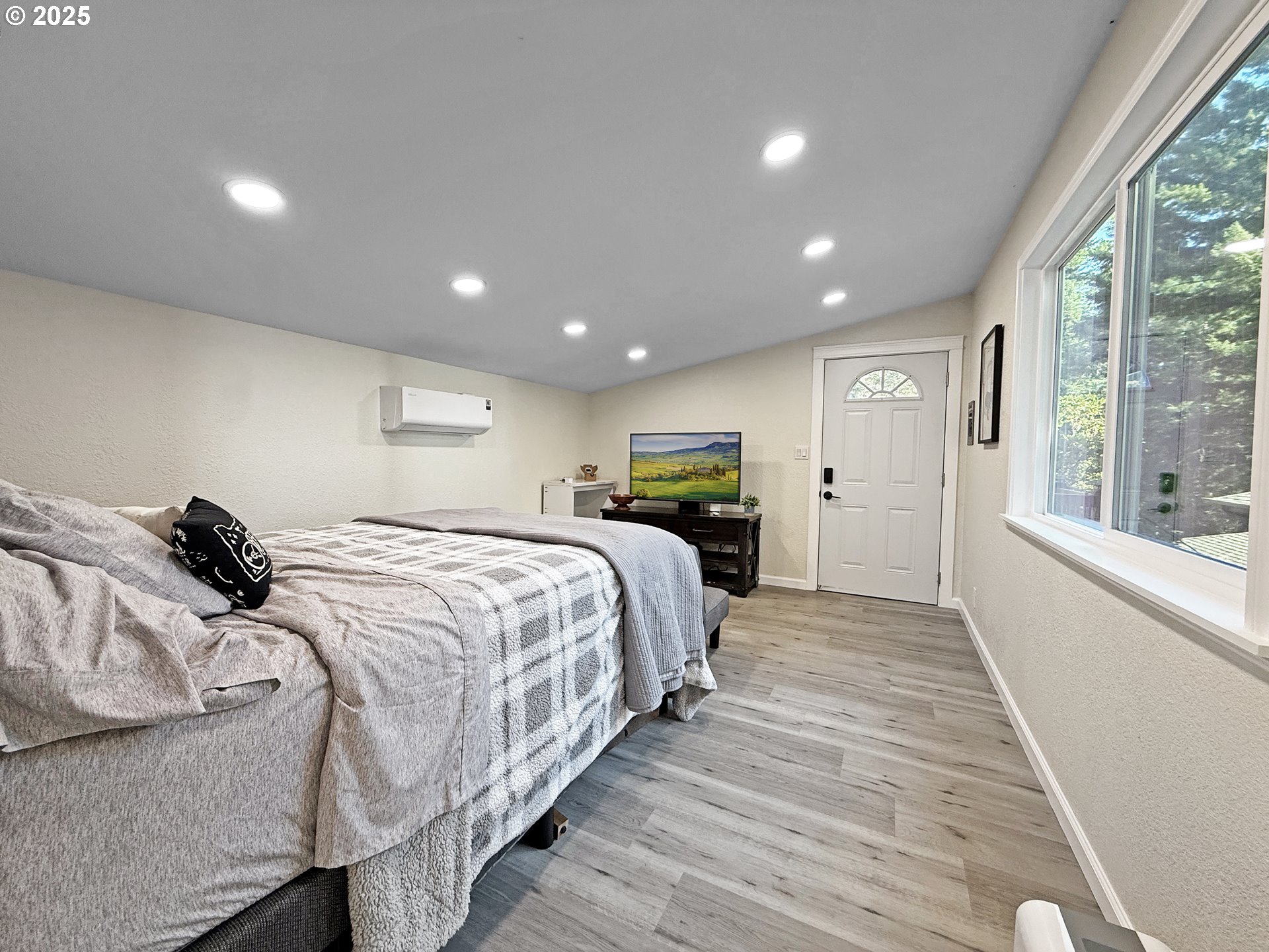18950 Timeus Ranch Road Brookings, OR 97415 - Photo 42 of 47 a spacious bedroom with a bed and a large window