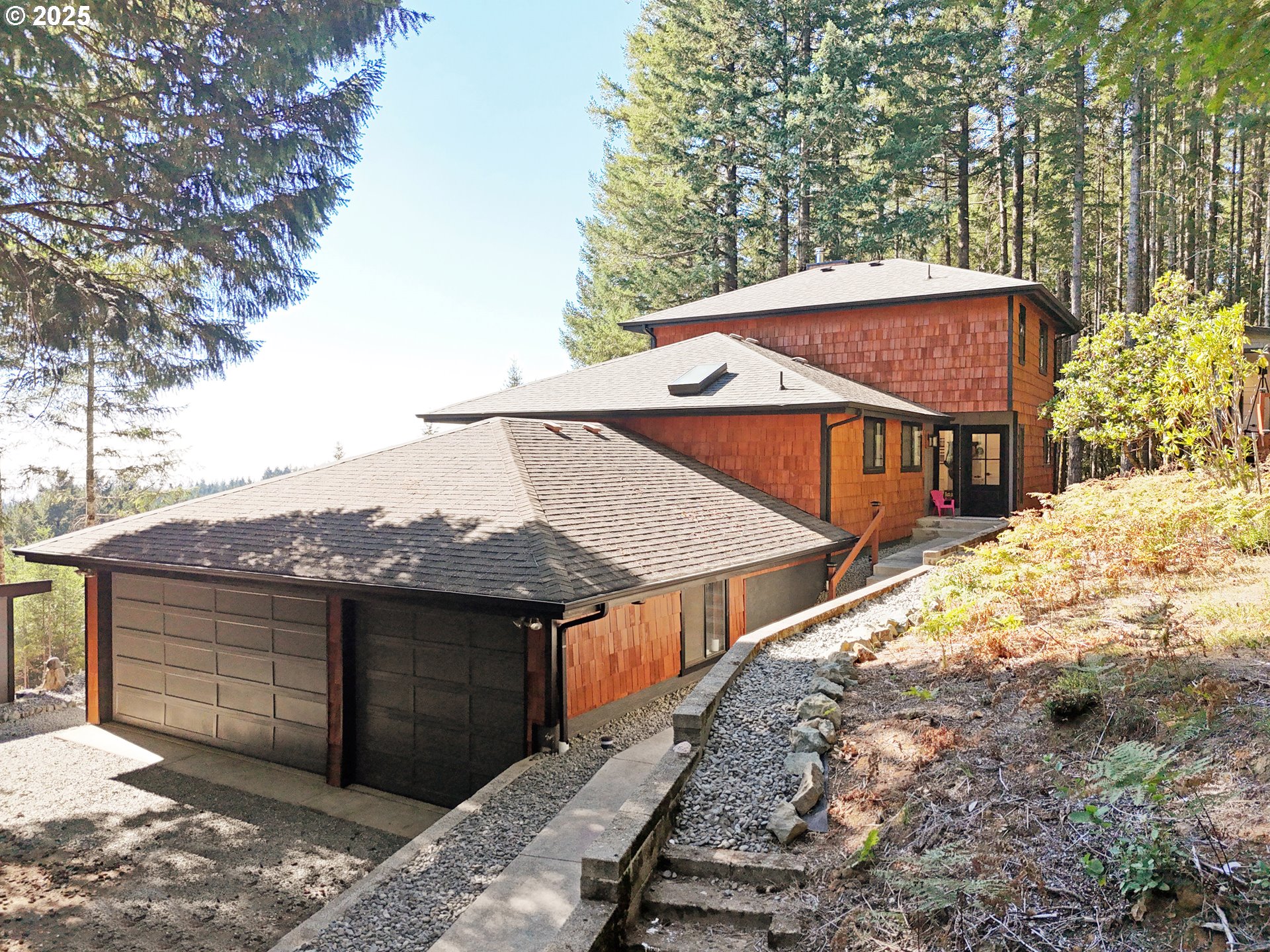 18950 Timeus Ranch Road Brookings, OR 97415 - Photo 5 of 47 a view of a house with a yard