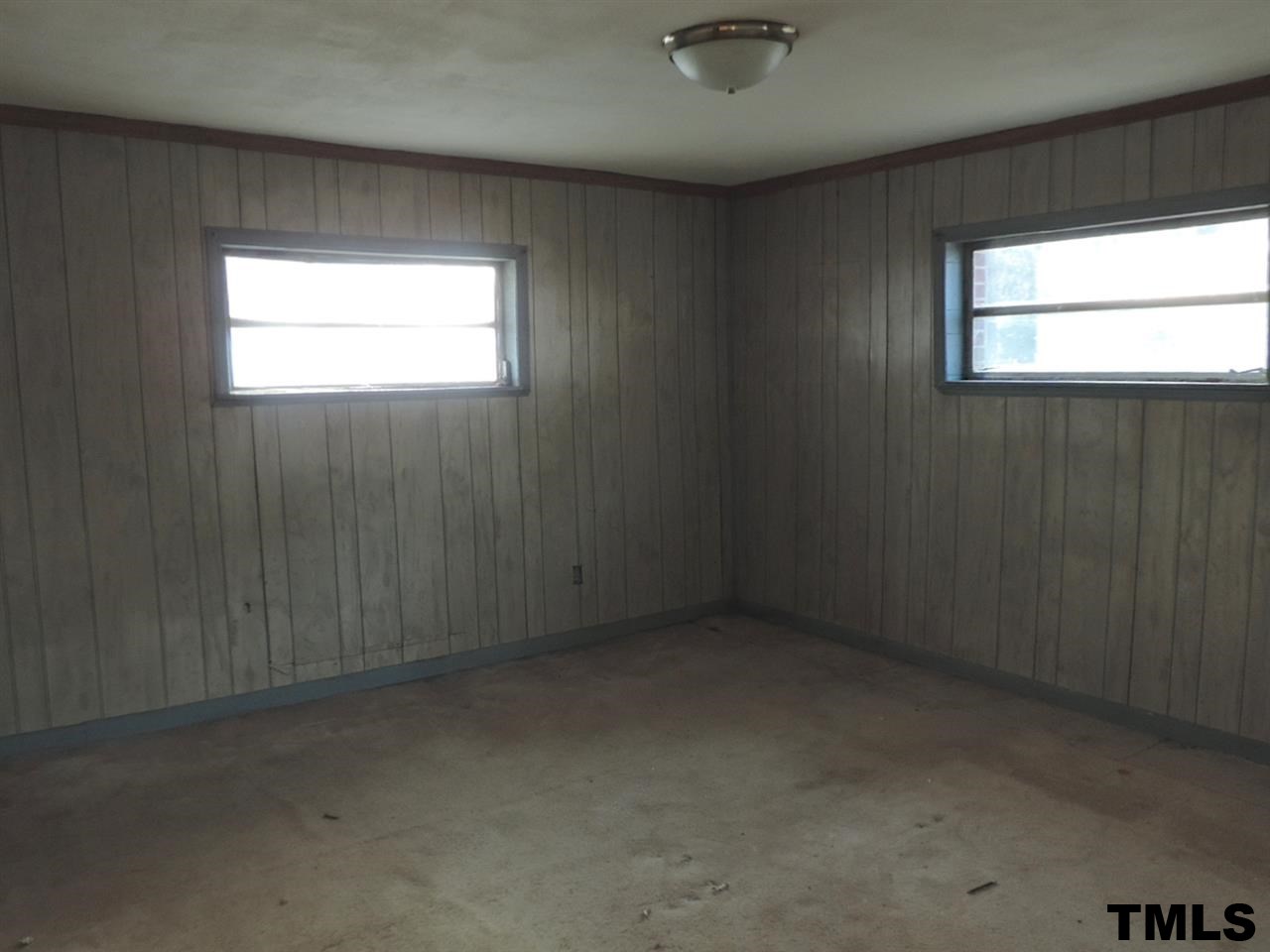 6020 Neuse Street Raleigh, NC 27610 - Photo 11 of 25 an empty room with a window