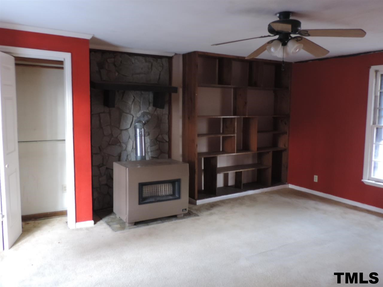 6020 Neuse Street Raleigh, NC 27610 - Photo 14 of 25 an empty room with closet and chandelier fan