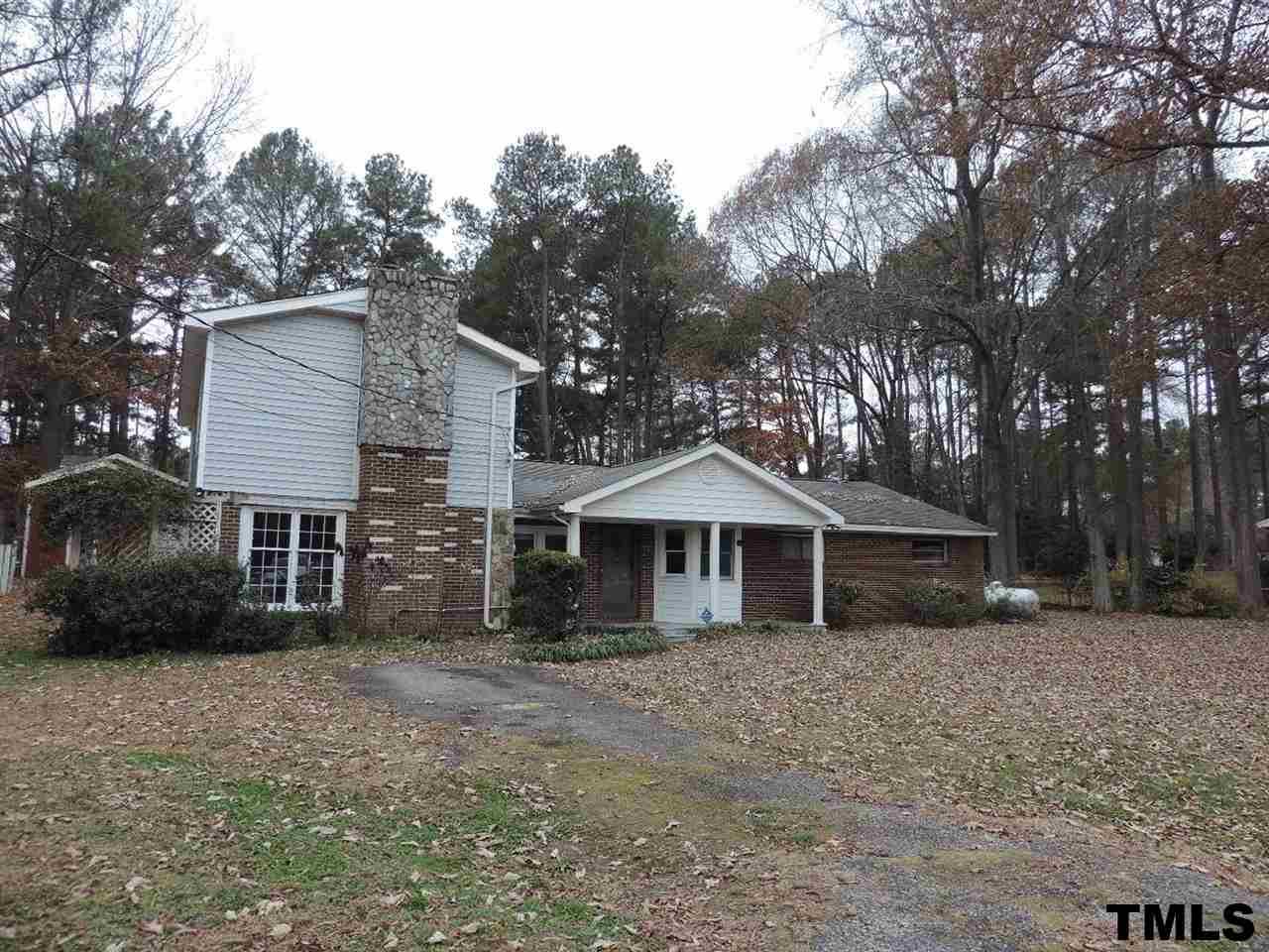 6020 Neuse Street Raleigh, NC 27610 - Photo 16 of 25 a front view of a house with a yard