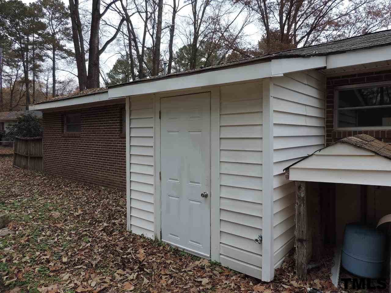 6020 Neuse Street Raleigh, NC 27610 - Photo 18 of 25 a view of a house with a tree