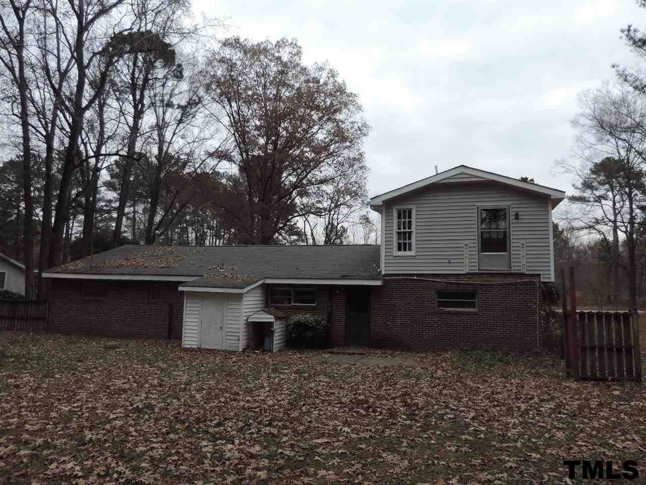 6020 Neuse Street Raleigh, NC 27610 - Photo 19 of 25 a front view of a house with a yard