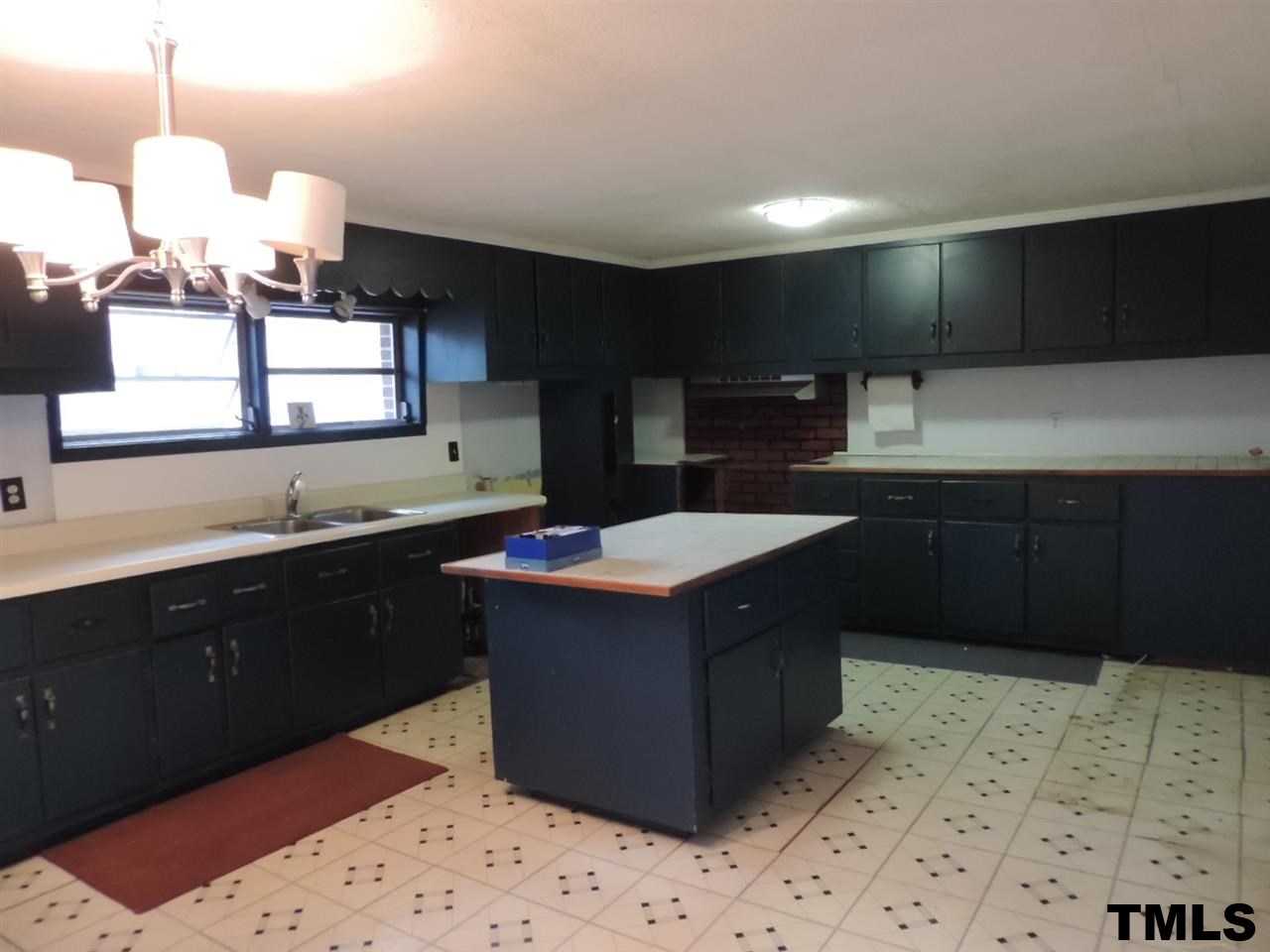 6020 Neuse Street Raleigh, NC 27610 - Photo 3 of 25 a kitchen with a cabinets and sink