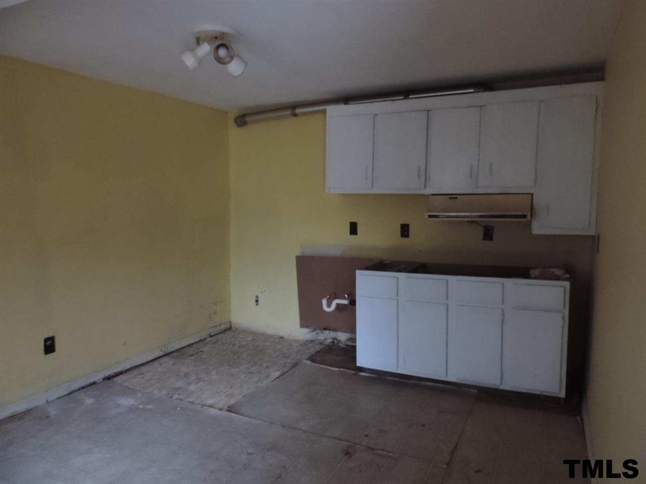 6020 Neuse Street Raleigh, NC 27610 - Photo 23 of 25 a kitchen with cabinets and sink
