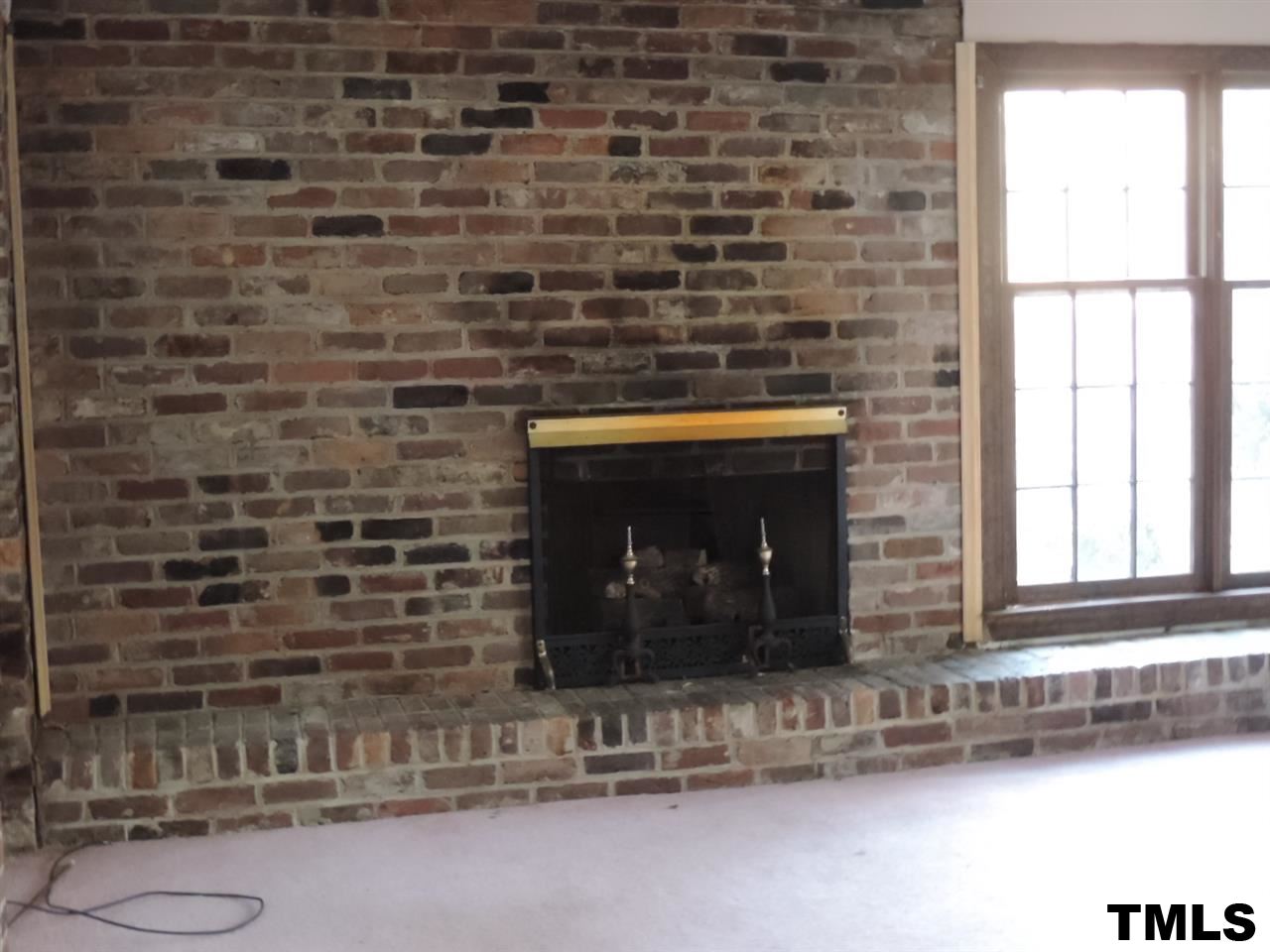6020 Neuse Street Raleigh, NC 27610 - Photo 6 of 25 a room with a fireplace