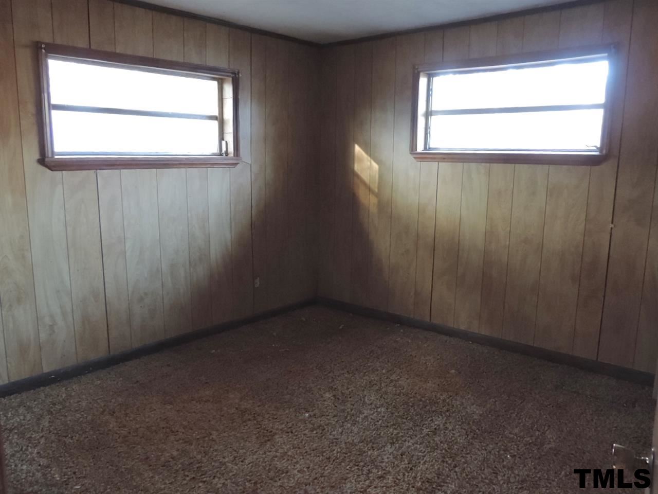 6020 Neuse Street Raleigh, NC 27610 - Photo 8 of 25 an empty room with a window