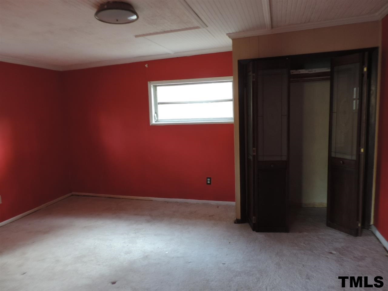 6020 Neuse Street Raleigh, NC 27610 - Photo 10 of 25 an empty room with a empty space and windows
