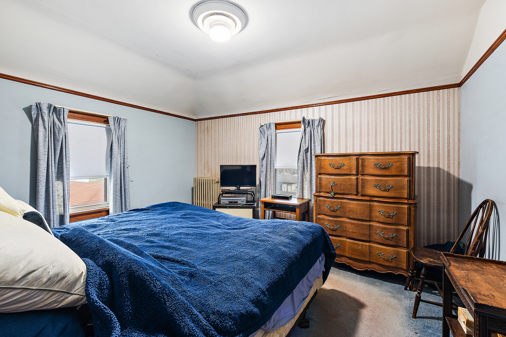 17930 Homewood Avenue Homewood, IL 60430 - Photo 17 of 30 a bedroom with a bed and furniture
