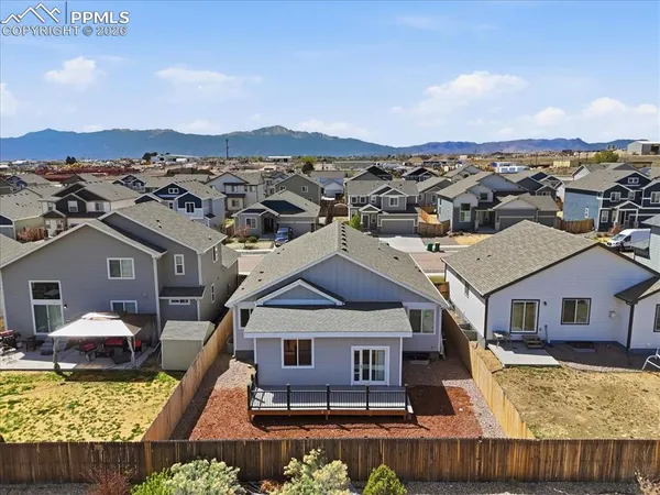an aerial view of a house with swimming pool
