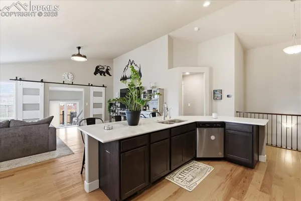 a spacious bathroom with a sink double vanity granite and a mirror