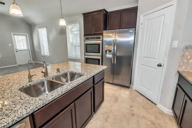 a kitchen with a stove and a microwave