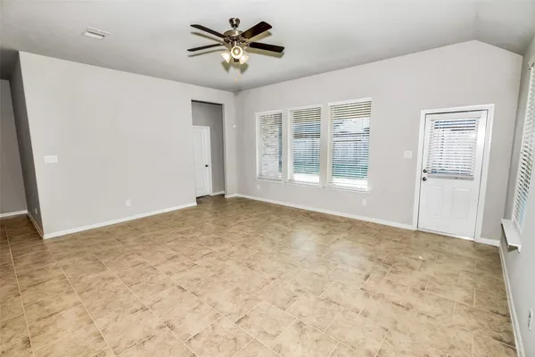 a view of an empty room with a window