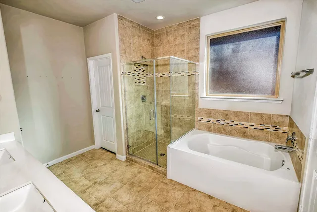 a bathroom with a sink double vanity granite and a mirror