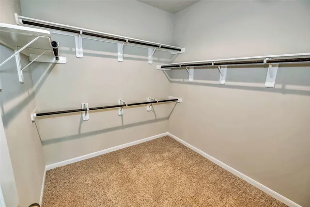 a view of hallway with wooden floor