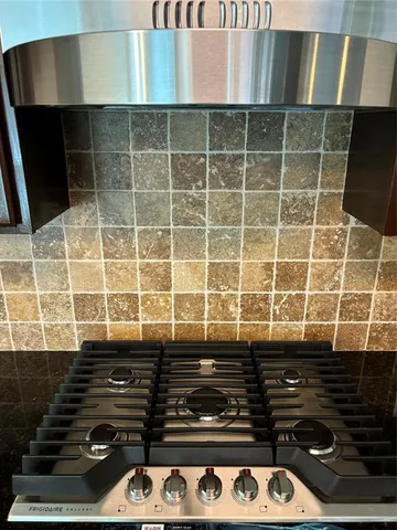 a view of a room with wooden floor and a window