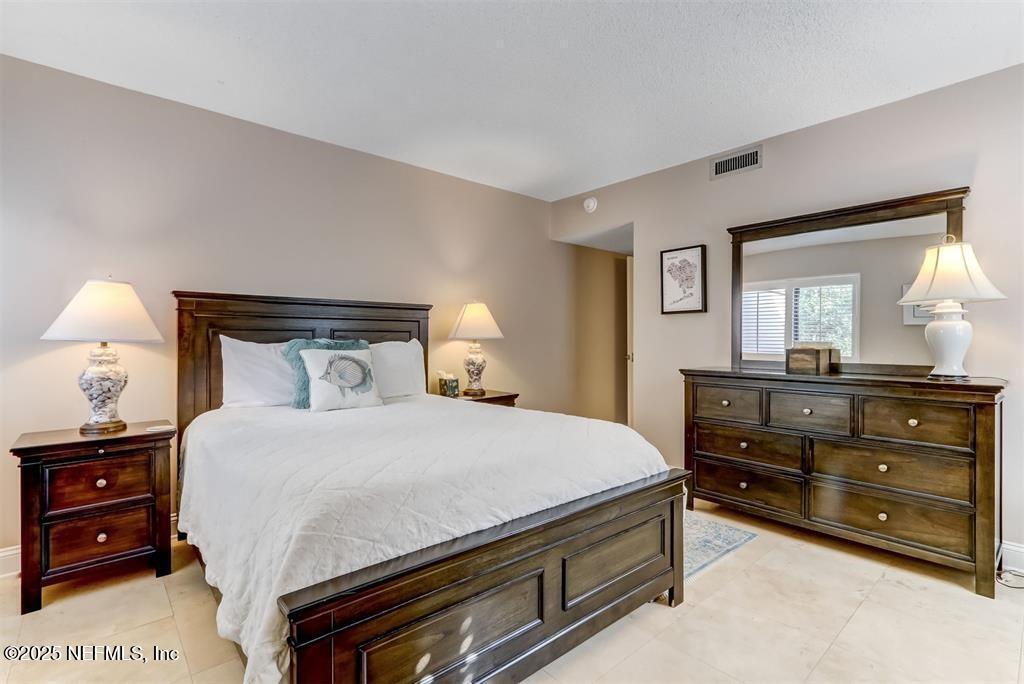 2122 Beachwood Road, Unit 2122 Fernandina Beach, FL 32034 - Photo 17 of 41 a bedroom with a bed and a dresser