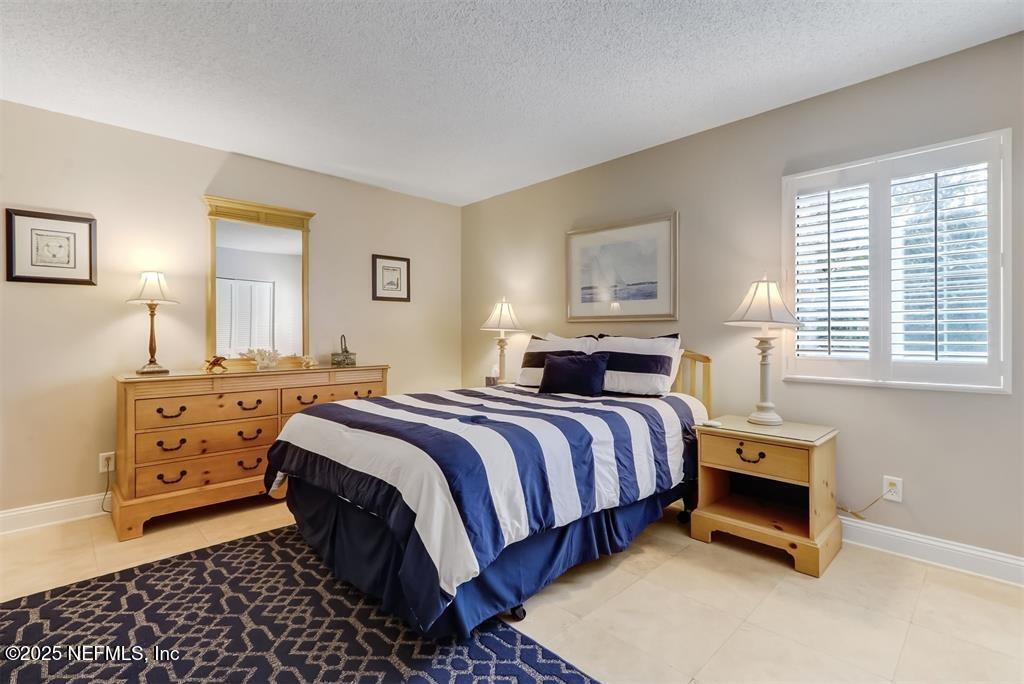 2122 Beachwood Road, Unit 2122 Fernandina Beach, FL 32034 - Photo 20 of 41 a bedroom with a bed and a window