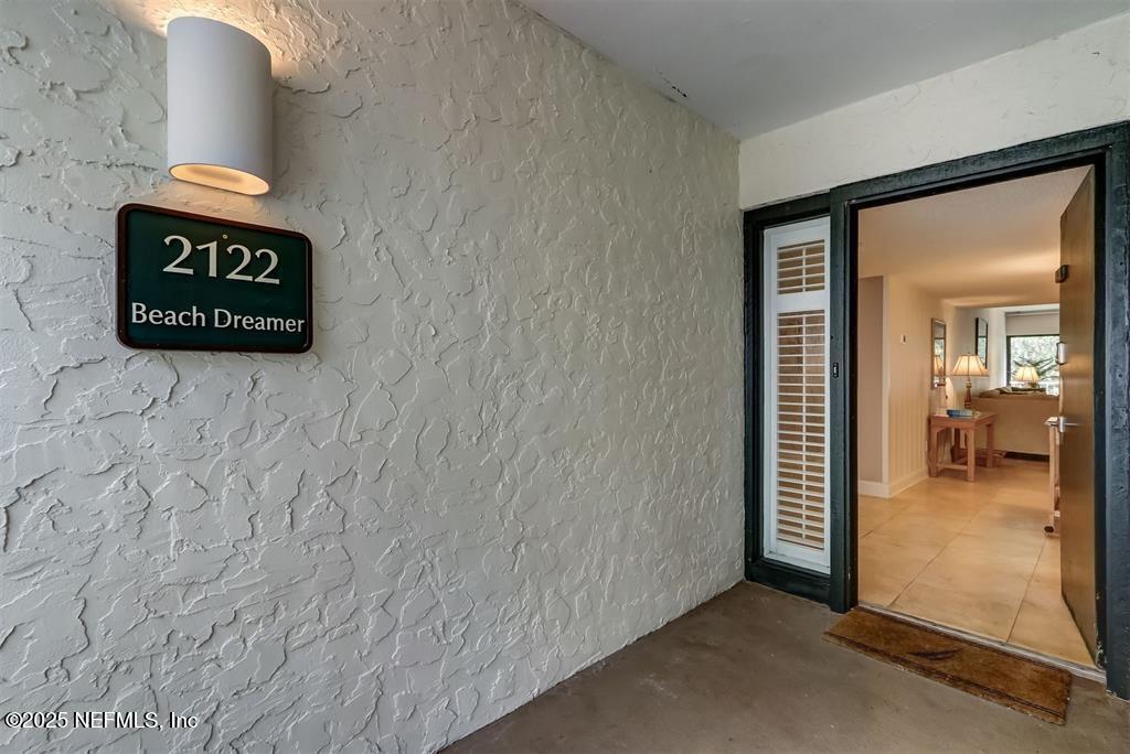 2122 Beachwood Road, Unit 2122 Fernandina Beach, FL 32034 - Photo 2 of 41 a view of a hallway with a wooden door