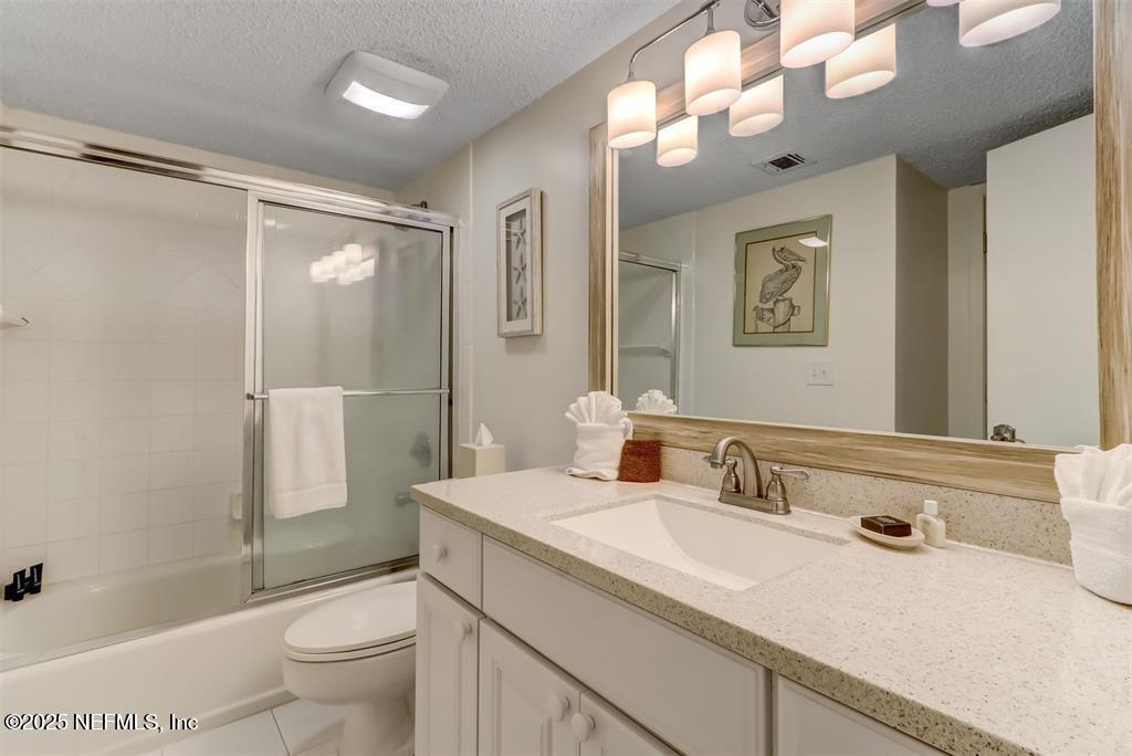 2122 Beachwood Road, Unit 2122 Fernandina Beach, FL 32034 - Photo 22 of 41 a bathroom with a sink toilet double vanity and shower