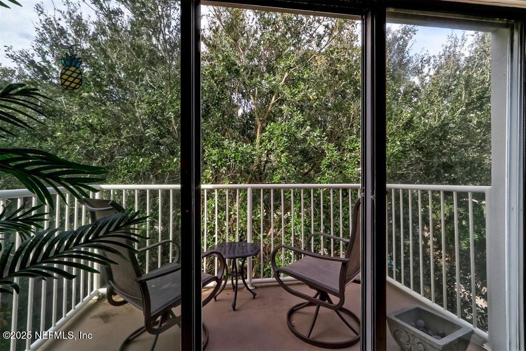 2122 Beachwood Road, Unit 2122 Fernandina Beach, FL 32034 - Photo 4 of 41 a view of a two chairs and table in the balcony