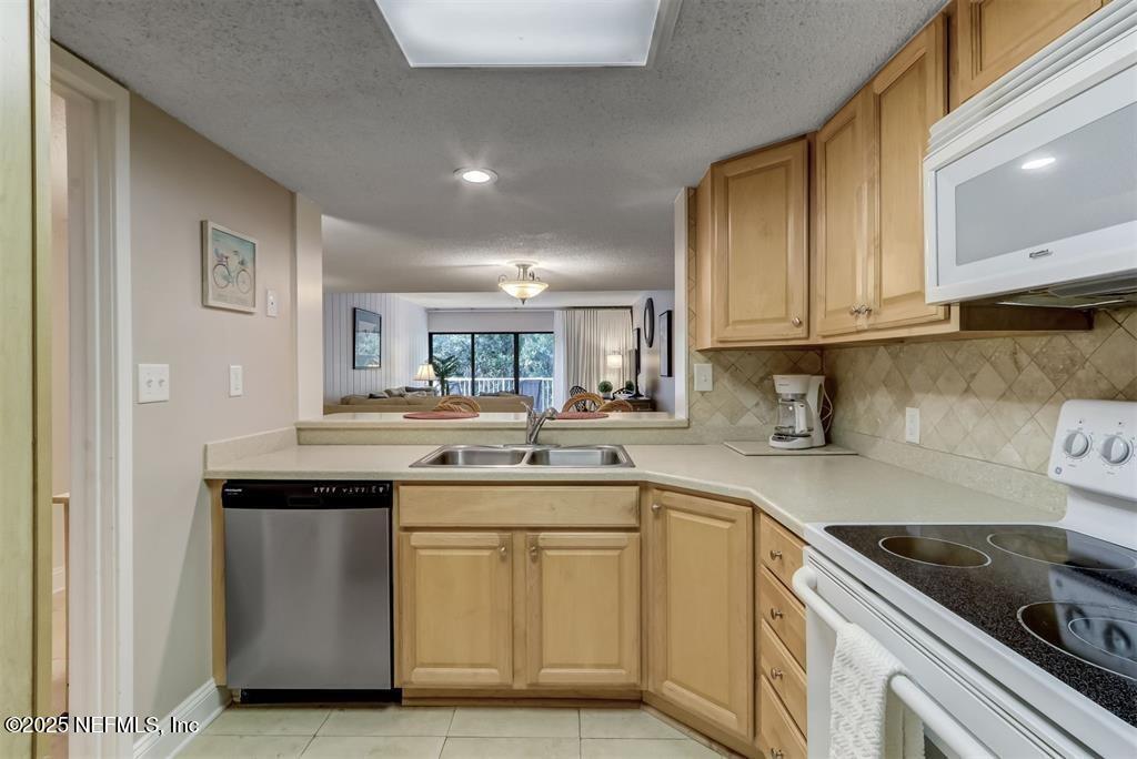 2122 Beachwood Road, Unit 2122 Fernandina Beach, FL 32034 - Photo 8 of 41 a kitchen with a sink stove and cabinets