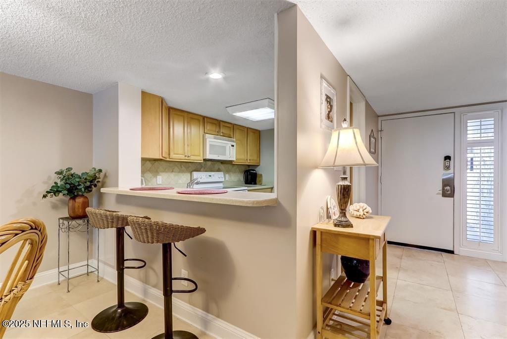 2122 Beachwood Road, Unit 2122 Fernandina Beach, FL 32034 - Photo 10 of 41 a view of kitchen island table and chairs