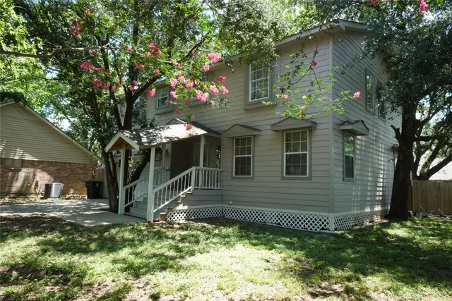 a backyard of a house with lots of green space