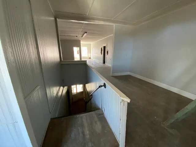 a bathroom with a sink a toilet a mirror and shower