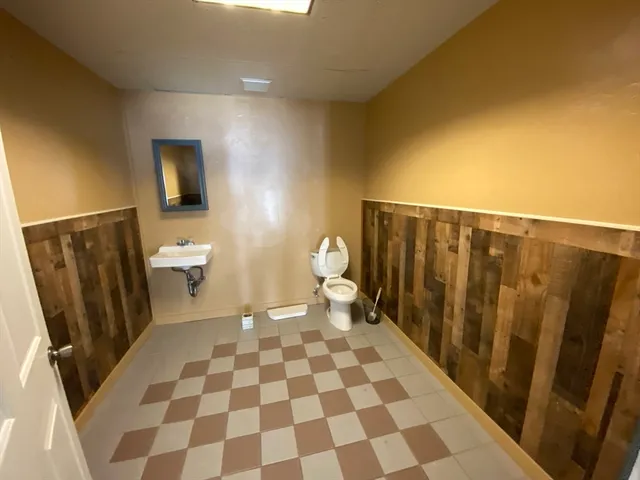 a view of entryway with window and wooden floor